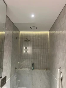 Waterproof shower downlight and cove lighting installed in a Paddington bathroom