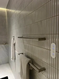Recessed bathroom niche with switch and LED strip lighting installed by Hassett Electrical in a Paddington home