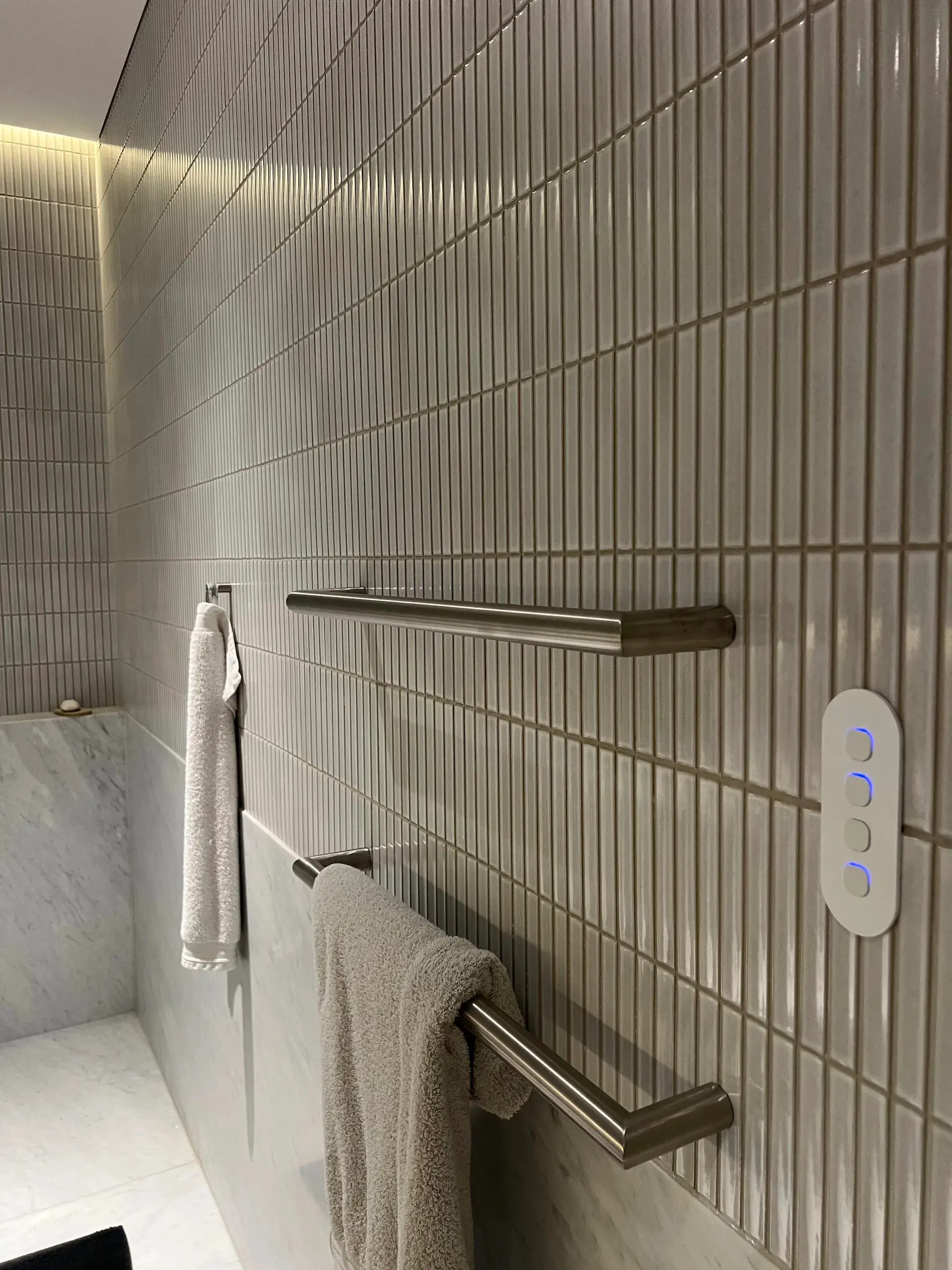 Recessed bathroom niche with switch and LED strip lighting installed by Hassett Electrical in a Paddington home
