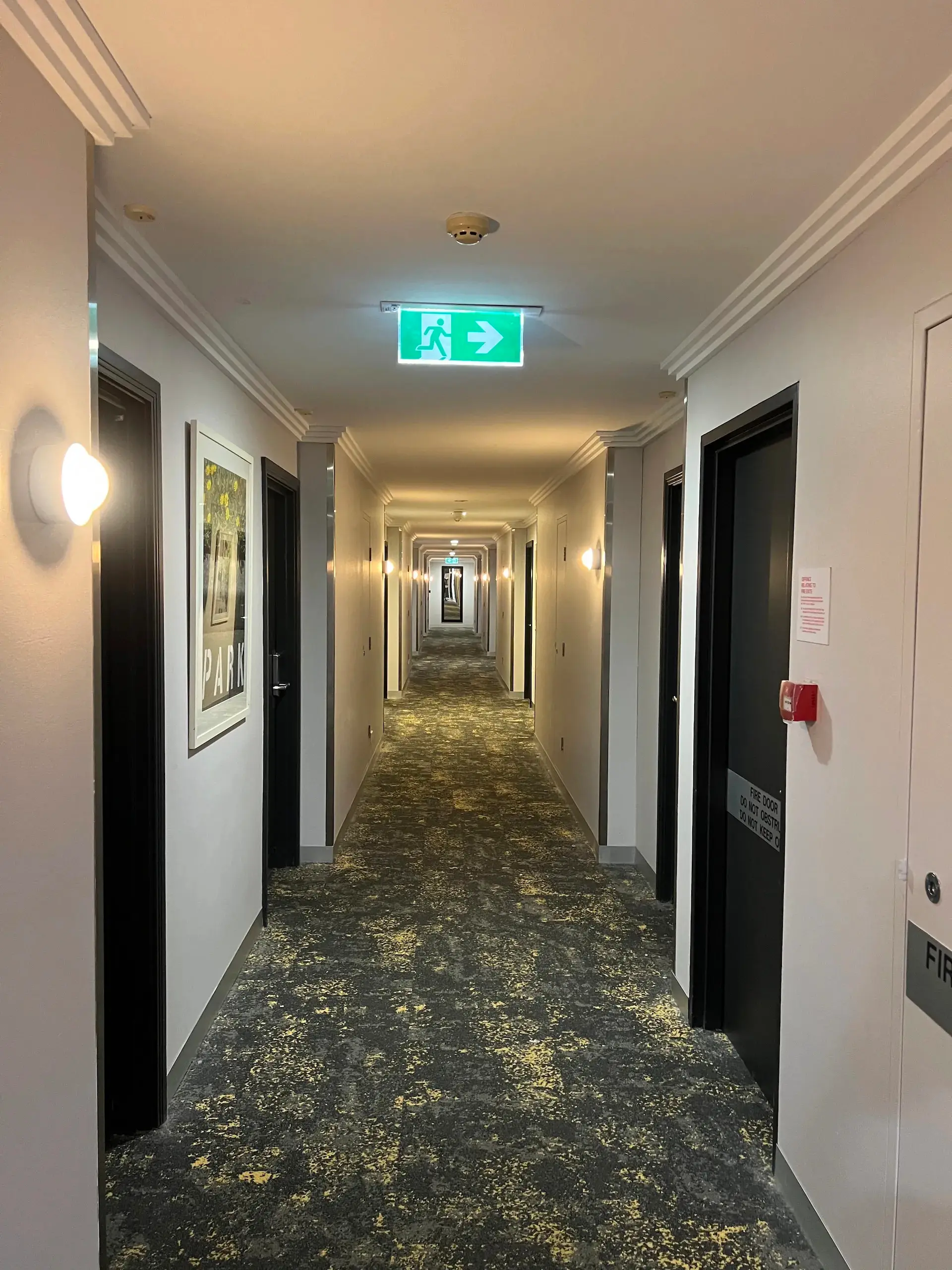 Completed hotel corridor lighting and emergency exit signage at the Mercure Hotel, Macquarie Park