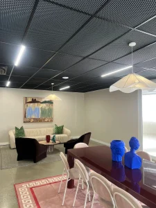 Lounge area lighting fitout with pendant and track lighting in Rosebery