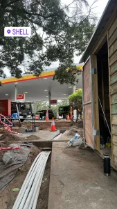 Underground electrical conduit installation at a Shell service station